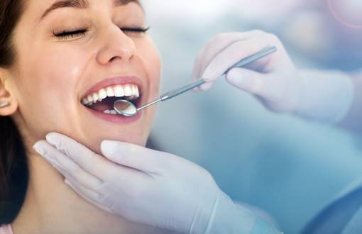 Dentist Checking Womans Teeth